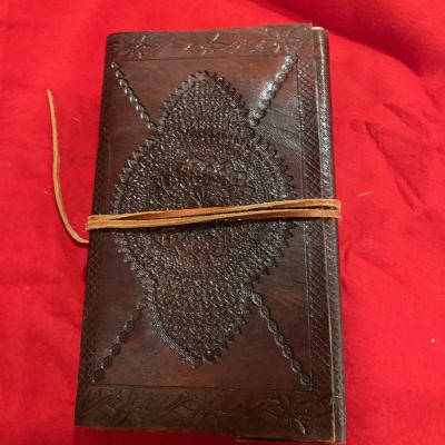 Hand tooled leather journal with homemade cotton pages
